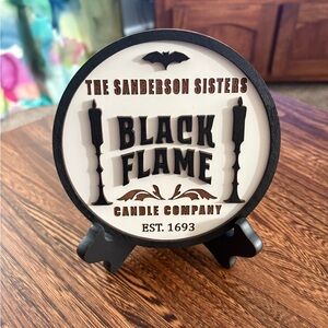 The Sanderson Sister Black Flame Candle Company Sign With Table Easel